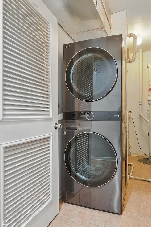 4843 N Harding Ave Unit 1N, Chicago, IL 60625 - laundry area featuring estacked washer and dryer and tile patterned floors