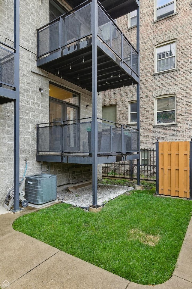 4843 N Harding Ave Unit 1N, Chicago, IL 60625 - view of green lawn with a balcony and cooling unit