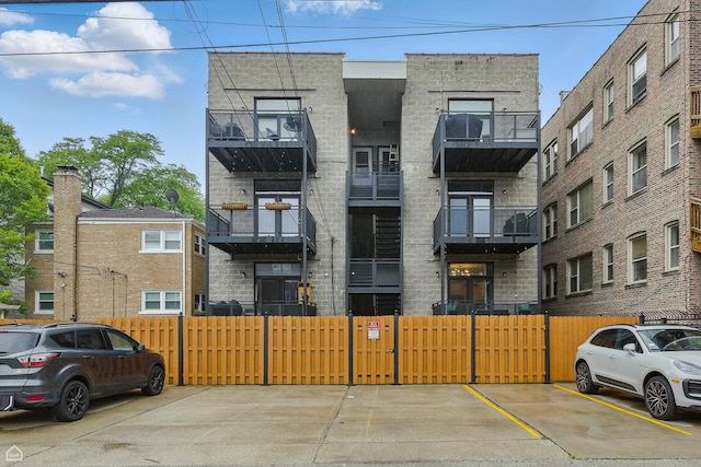 4843 N Harding Ave Unit 1N, Chicago, IL 60625 - view of apartment building / complex featuring uncovered parking