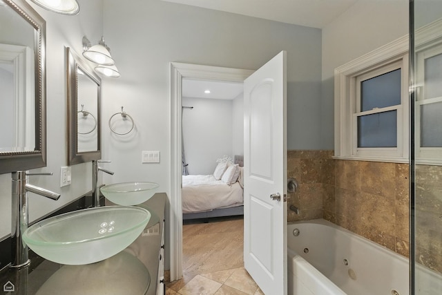 4843 N Harding Ave Unit 1N, Chicago, IL 60625 - bathroom with a tub with jets, double vanity, and ensuite bath