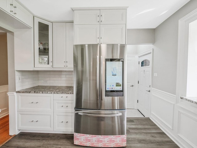 kitchen with glass insert cabinets, smart refrigerator, white cabinets, dark wood-style flooring, and light stone countertops