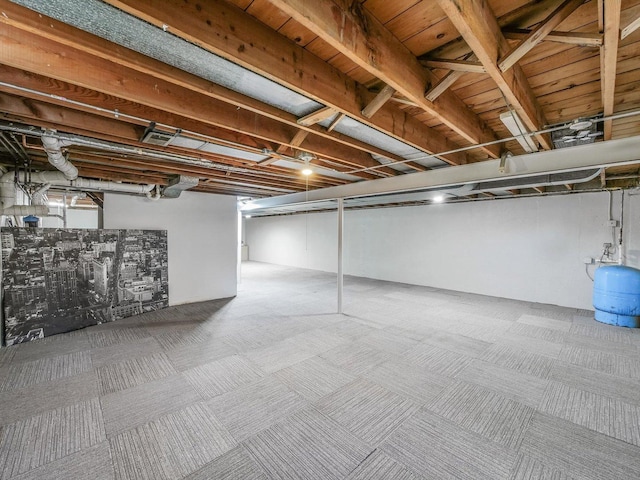 below grade area featuring carpet flooring