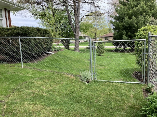 view of yard with a gate and fence