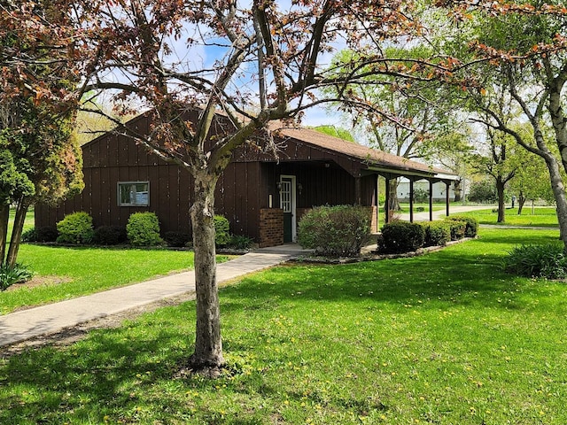 view of front of home with a front yard and board and batten siding