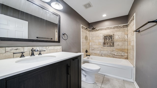 bathroom with toilet,  shower combination, vanity, and visible vents