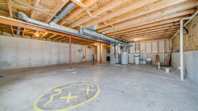 unfinished below grade area featuring water heater