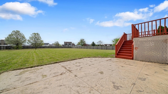 view of patio with a fenced backyard and stairway