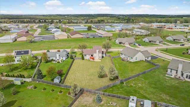 birds eye view of property with a residential view