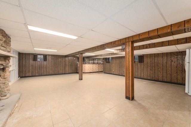 1921 Elm St, Park Ridge, IL 60068 - finished basement featuring a paneled ceiling, freestanding refrigerator, and wood walls
