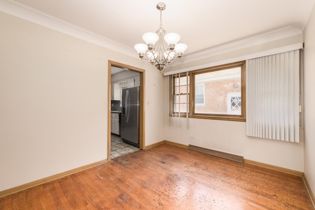 1921 Elm St, Park Ridge, IL 60068 - spare room with light wood-style flooring, a chandelier, baseboards, and crown molding