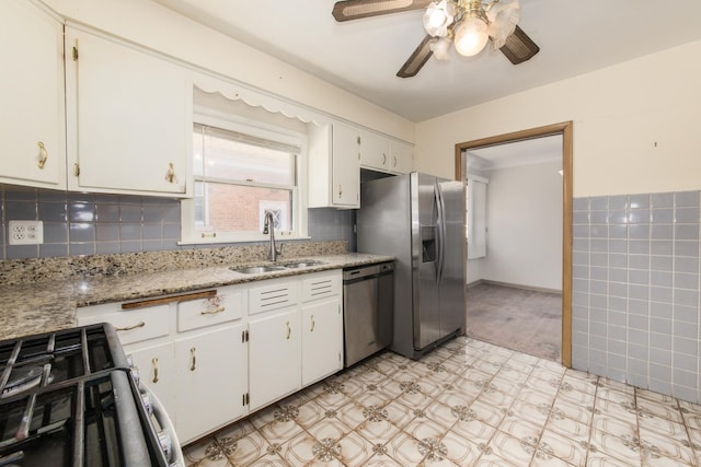1921 Elm St, Park Ridge, IL 60068 - kitchen with a sink, stainless steel appliances, light floors, a ceiling fan, and white cabinetry