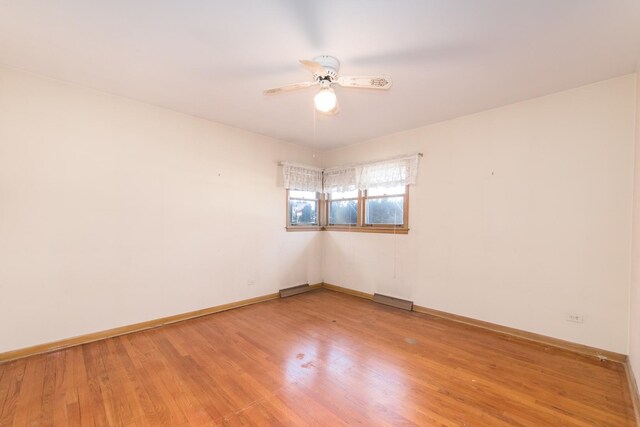 1921 Elm St, Park Ridge, IL 60068 - empty room with a ceiling fan, light wood finished floors, and baseboards