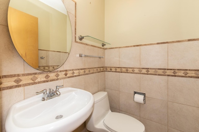1921 Elm St, Park Ridge, IL 60068 - half bathroom with tile walls, a sink, toilet, and a wainscoted wall