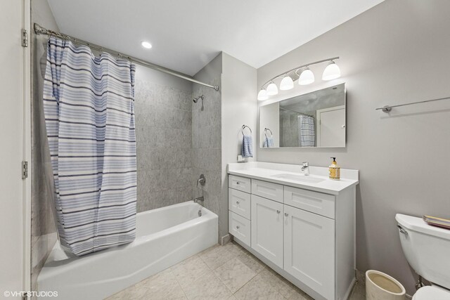 full bath featuring shower / bath combo, toilet, and vanity