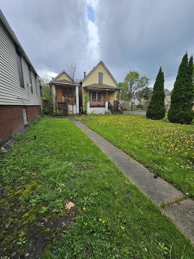 11920 S Calumet Ave, Chicago, IL 60628 - view of yard featuring covered porch