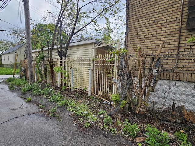 11920 S Calumet Ave, Chicago, IL 60628 - view of side of home with fence and brick siding