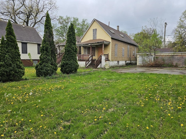 11920 S Calumet Ave, Chicago, IL 60628 - view of front of property featuring a porch and a front lawn