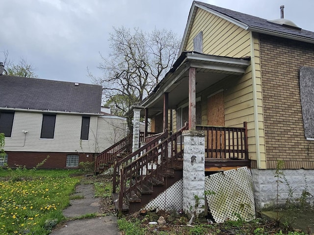 11920 S Calumet Ave, Chicago, IL 60628 - view of side of home with covered porch and stairway