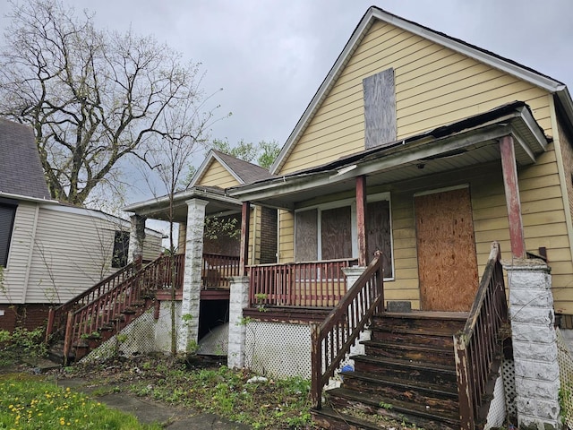 11920 S Calumet Ave, Chicago, IL 60628 - bungalow-style home featuring covered porch and stairs