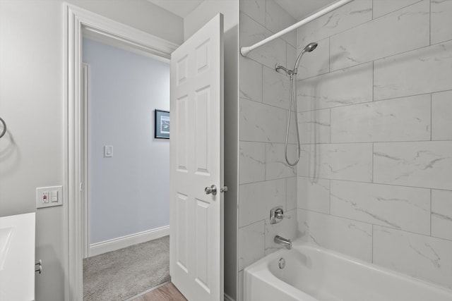 5177 Coventry Ln Unit D, Gurnee, IL 60031 - bathroom featuring baseboards, shower / bathtub combination, and wood finished floors