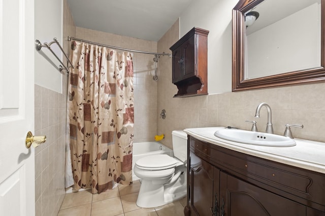 full bathroom with tile walls, shower / tub combo, toilet, tile patterned flooring, and vanity