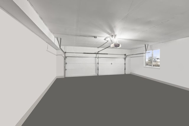 garage featuring baseboards and a garage door opener