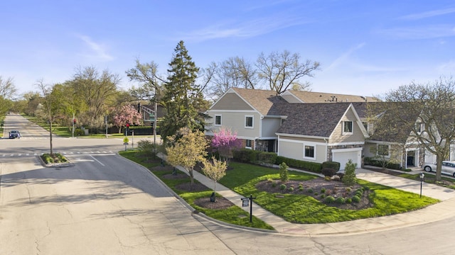 view of front of property with concrete driveway, an attached garage, and stone siding