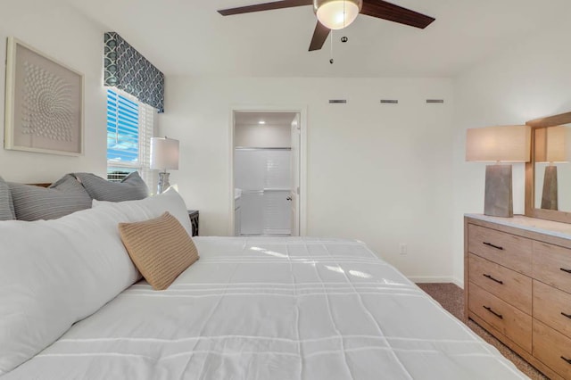 bedroom featuring a ceiling fan, baseboards, ensuite bathroom, carpet flooring, and visible vents