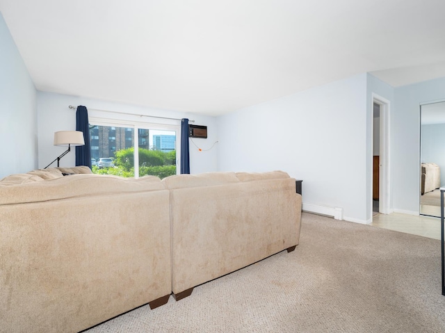 living room featuring carpet flooring, baseboards, and a baseboard heating unit