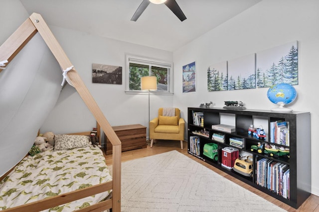 bedroom featuring wood finished floors and a ceiling fan
