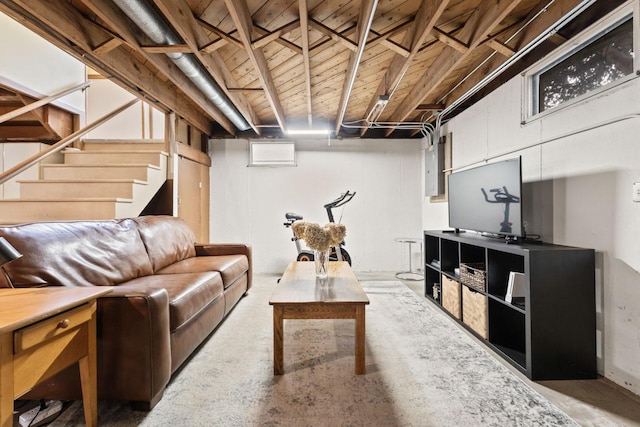living room with concrete floors and stairway