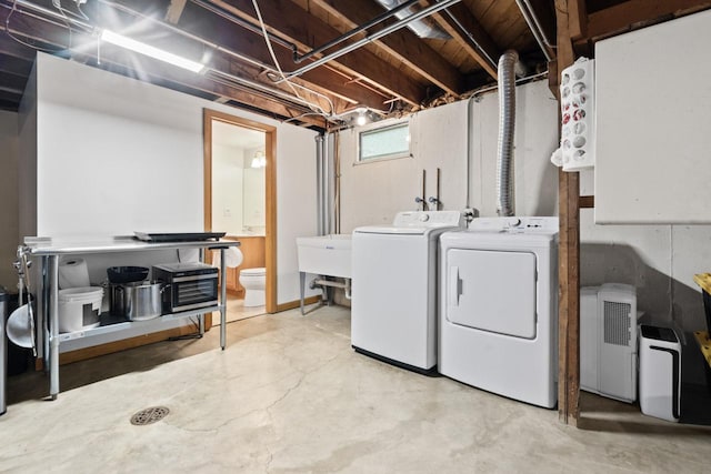 washroom with independent washer and dryer