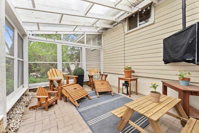 sunroom / solarium featuring healthy amount of natural light