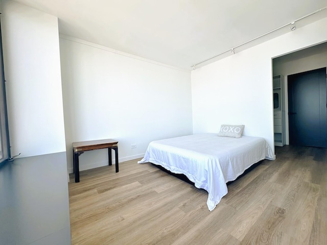 bedroom with light wood-type flooring