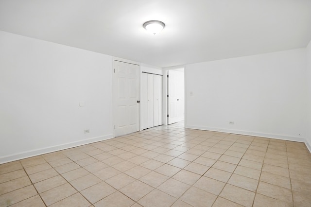 spare room featuring baseboards