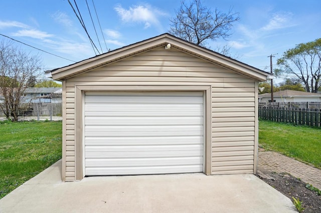detached garage featuring concrete driveway
