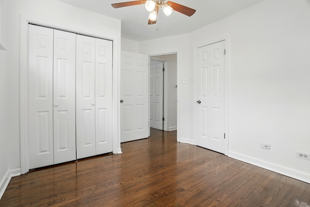 unfurnished bedroom with dark wood-style floors, baseboards, and ceiling fan