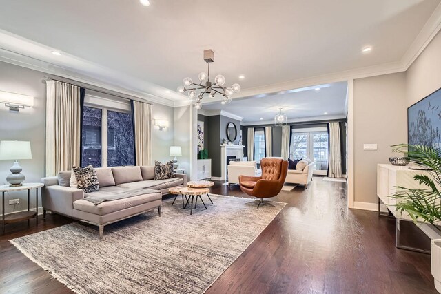 1955 N Halsted St Unit 1, Chicago, IL 60614 - living area with a chandelier, crown molding, dark wood finished floors, baseboards, and recessed lighting