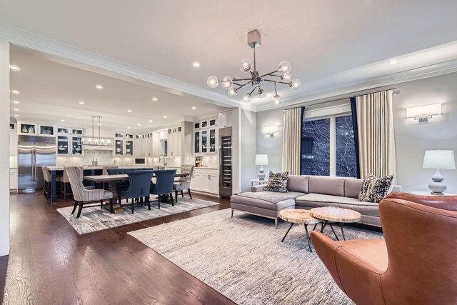 1955 N Halsted St Unit 1, Chicago, IL 60614 - living room with a chandelier, dark wood-type flooring, recessed lighting, crown molding, and baseboards