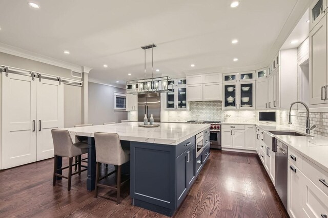 1955 N Halsted St Unit 1, Chicago, IL 60614 - dining area featuring a chandelier, ornamental molding, dark wood-style flooring, recessed lighting, and baseboards