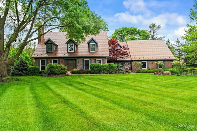 11 N Meadow Ct, South Barrington, IL 60010 - new england style home with brick siding, a front lawn, and a chimney