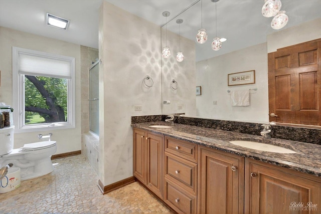 11 N Meadow Ct, South Barrington, IL 60010 - bathroom with toilet, shower / bath combination with glass door, double vanity, and baseboards