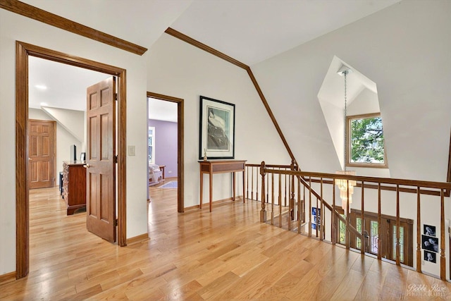 11 N Meadow Ct, South Barrington, IL 60010 - hallway featuring light wood-style flooring, vaulted ceiling, baseboards, and an upstairs landing
