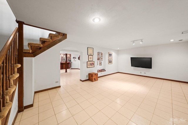 11 N Meadow Ct, South Barrington, IL 60010 - unfurnished living room featuring arched walkways, stairway, baseboards, and recessed lighting