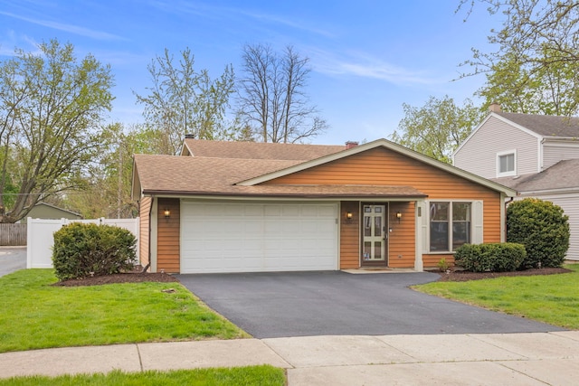 559 Coolidge Ave, Glen Ellyn, IL 60137 - view of front facade featuring an attached garage, asphalt driveway, a shingled roof, and a chimney