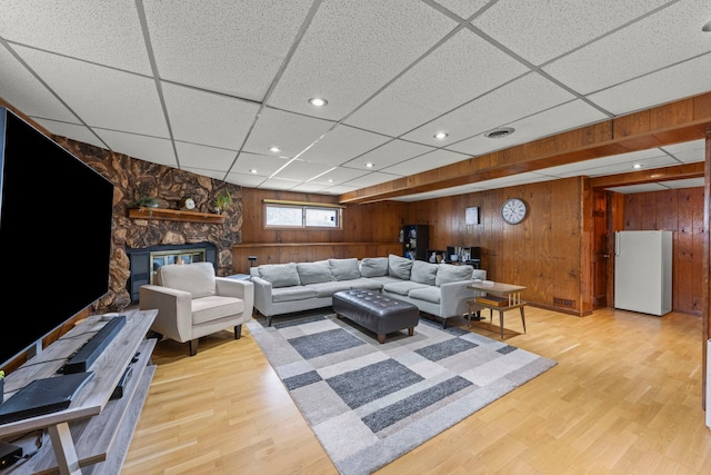 559 Coolidge Ave, Glen Ellyn, IL 60137 - living area featuring wood finished floors, wood walls, a paneled ceiling, recessed lighting, and a stone fireplace