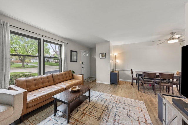 559 Coolidge Ave, Glen Ellyn, IL 60137 - living room with light wood-style flooring, baseboards, and a ceiling fan