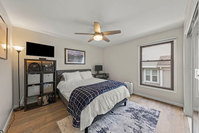 559 Coolidge Ave, Glen Ellyn, IL 60137 - bedroom featuring baseboards, wood finished floors, and a ceiling fan