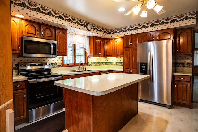 214 W Watson St, Forrest, IL 61741 - kitchen featuring appliances with stainless steel finishes, a sink, light countertops, and decorative backsplash