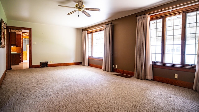 214 W Watson St, Forrest, IL 61741 - unfurnished room with a ceiling fan, carpet floors, and baseboards